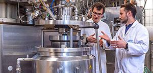 Lukas Böcker and Leandro Buchmann working on food processing. Lukas Böcker and Leandro Buchmann working on food processing.